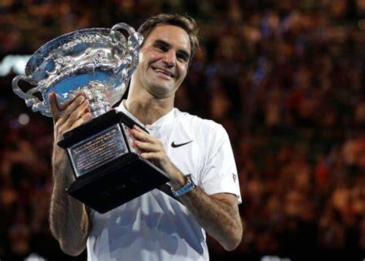 Roger Federer with French Open trophy PA